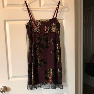Wine color with velvet straps and appliqués.  Black lace around the bottom.